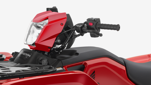 An up close view of the handlebars of a Honda Foreman