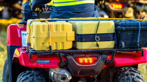 Close up of luggage on rear rack. Yellow and black boxes.