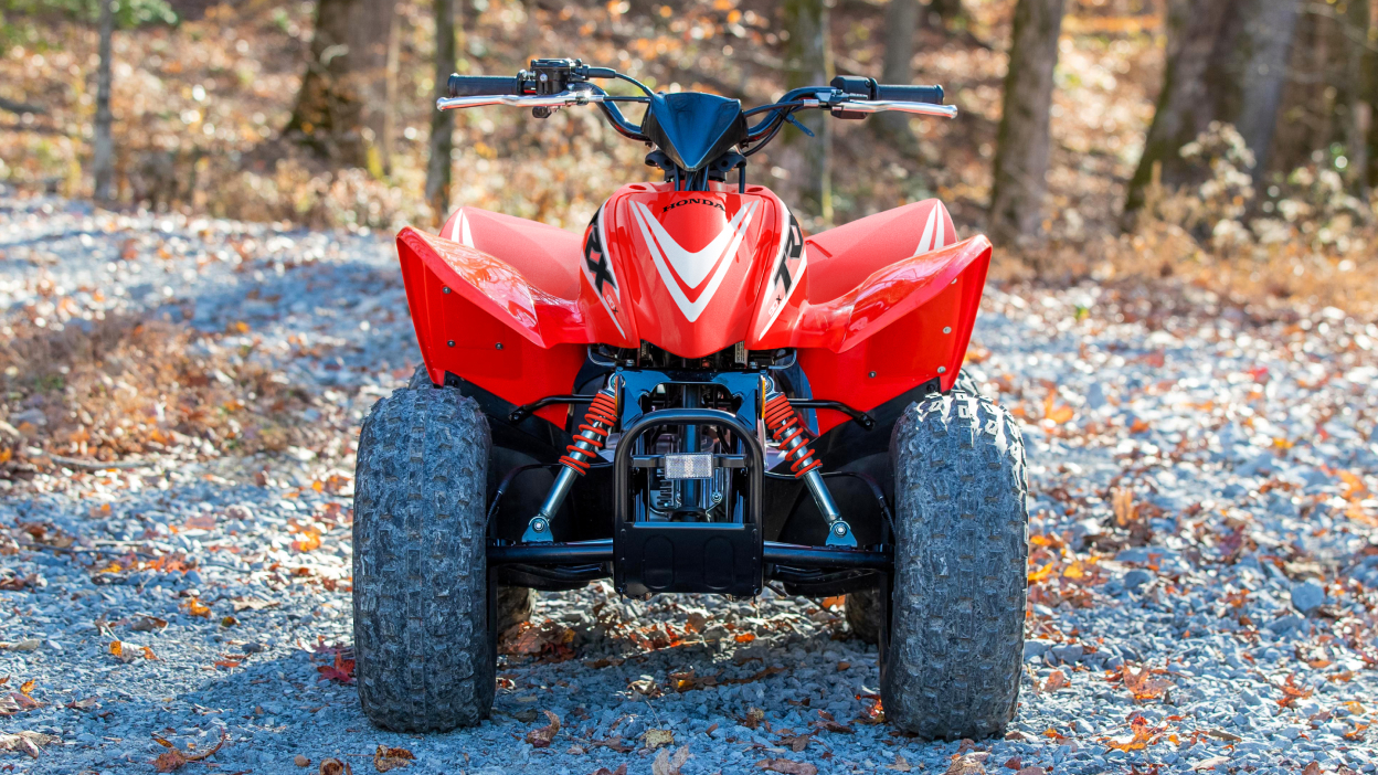 TRX90X front view in woods.