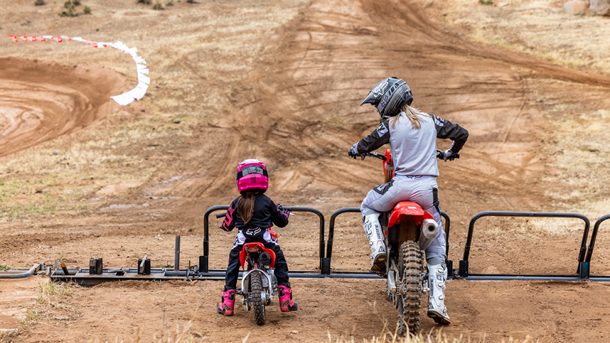 The back view of two riders and their Honda Trail bikes