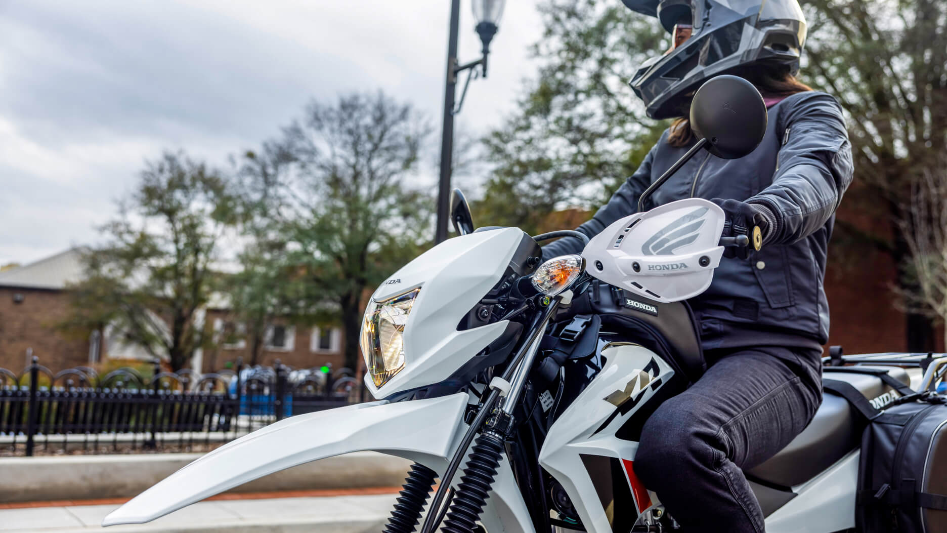 A rider parked on a Honda XR150L