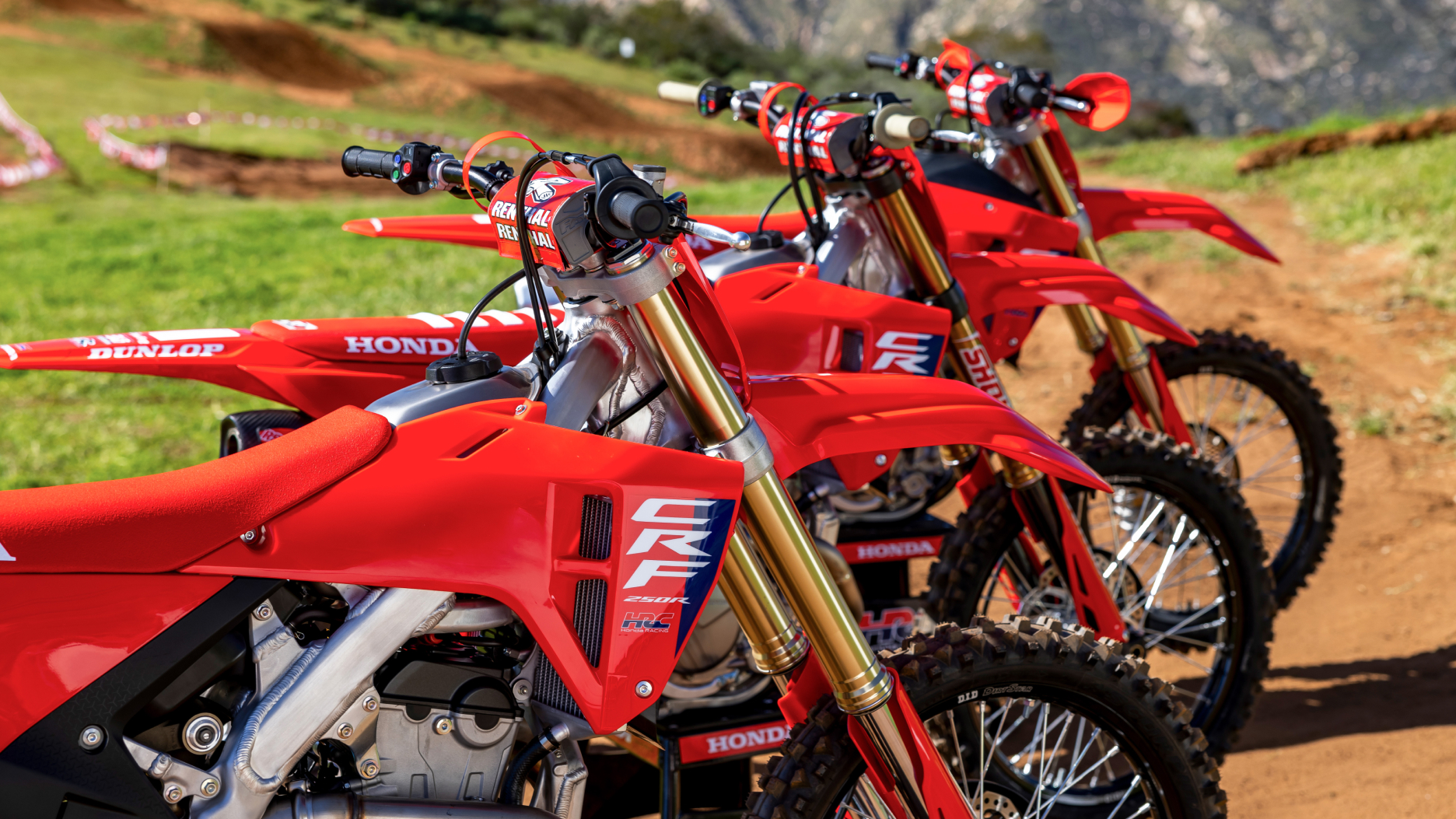 Close up of top of motorbikes facing right.