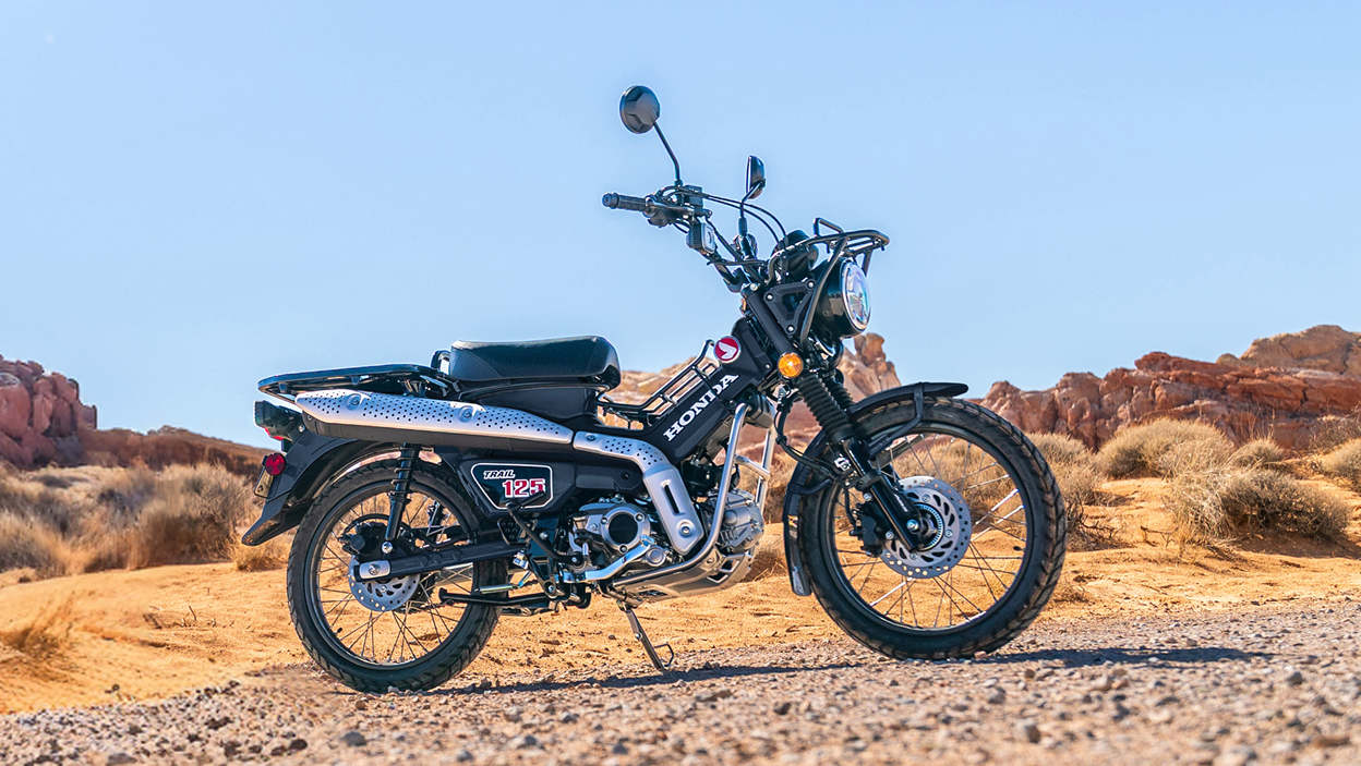 Trail 125 stationary in desert landscape.