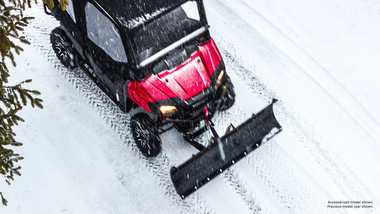 A back view of a Honda Pioneer on a trail
