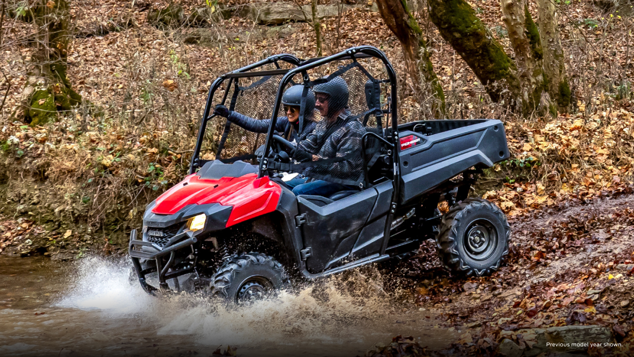 Lifestyle. Driver and passenger going left into water on slight decline.