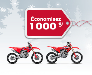 2 vélos de compétition CRF sur un fond d'hiver avec des flocons de neige, avec une étiquette de cadeau rouge annonçant un rabais de 1000 $